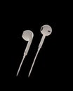 Headphones On Black Background For Listening Music And E-Books On Mobile Portable Devices With Copy Space.