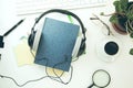 Headphones,book and keyboard on table