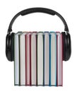 Headphones on books on white background.