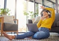 Headphones, computer and home of woman dancing, singing and happy music, podcast streaming or audio. Floor, carpet and