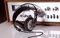 Headphones connected to vintage audio stereo Royalty Free Stock Photo