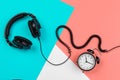 Headphones with cord on a bright color block background Royalty Free Stock Photo