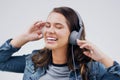 Headphones, dance or happy woman streaming music in studio for singing on grey background to relax. Model, podcast or Royalty Free Stock Photo