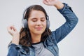 Headphones, dance or woman streaming music in studio for wellness on grey background to relax. Model, podcast or calm Royalty Free Stock Photo