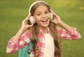 Headphones designed to help you relax. Happy child wear headphones outdoors. Small child listen to music in headphones