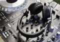 Headphones on a DJ console deck. Big DJ headphones for mixing music at a night club party. a Royalty Free Stock Photo