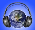 Headphones on earth Royalty Free Stock Photo