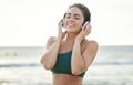 Headphones, fitness and happy woman on beach for wellness, mental health and audio streaming on mockup. Sound