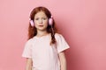 Headphones girl kid small cute portrait childhood music audio person little listen children Royalty Free Stock Photo
