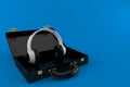 Headphones inside black briefcase