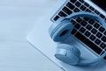 Headphones and laptop on table Royalty Free Stock Photo
