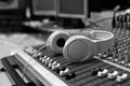 Headphones lying on the mixing console Royalty Free Stock Photo