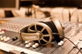 Headphones lying on the mixing console Royalty Free Stock Photo