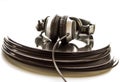 Headphones lying on the stack of vinyl records. Royalty Free Stock Photo