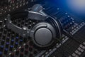 Headphones and Microphone on sound music mixer control panel. Royalty Free Stock Photo