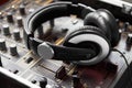 Headphones, mixer and sound engineering equipment in a recording studio for music production closeup. DJ, control and Royalty Free Stock Photo