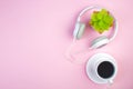 Headphones, mobile phone, idiobook, coffee cup on a pink background. The concept of leisure and learning, hobby. Listen to music, Royalty Free Stock Photo