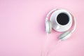Headphones, mobile phone, idiobook, coffee cup on a pink background. The concept of leisure and learning, hobby. Listen to music, Royalty Free Stock Photo