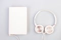 Headphones, mobile phone, idiobook, coffee cup on a white background. The concept of leisure and learning, hobby. Listen to music Royalty Free Stock Photo