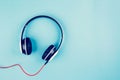 Headphones with music isolated on blue background, device headset and sound stereo. Royalty Free Stock Photo