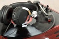 Headphones on an old retro record player Royalty Free Stock Photo