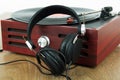 Headphones on an old retro record player Royalty Free Stock Photo