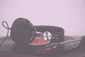 Headphones on an old retro record player Vintage Retro Filter. Royalty Free Stock Photo