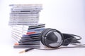 Headphones with a pile of CDs Royalty Free Stock Photo