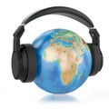 Headphones on planet Earth. Royalty Free Stock Photo