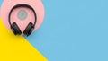 Headphones and vinyl record on pastel background Royalty Free Stock Photo