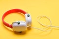 Headphones in white and red color with long wire