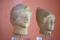 Heads of male and female figurines, close-up. Archaic period, Ancient Greece