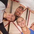 Heads together - fitness team in a gym
