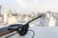 Headset and black notebook Royalty Free Stock Photo