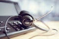 Headset headphones and telephone in call center Royalty Free Stock Photo