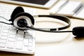 Headset and keyboard on workdesk for call center concept Royalty Free Stock Photo