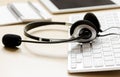 Headset and keyboard on workdesk for call center concept Royalty Free Stock Photo