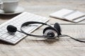 Headset and keyboard on workdesk for call center concept Royalty Free Stock Photo