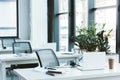 headsets and laptops on tables