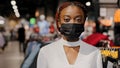 Headshot african american alone serious girl woman shopper consumer female consultant salesperson in medical face mask