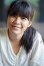 Headshot of asian teenager smiling face with relaxing mood Royalty Free Stock Photo