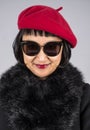 Headshot of an Asian Woman with Short Hair Wearing a Red Beret Royalty Free Stock Photo