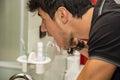 Headshot of attractive young man brushing teeth Royalty Free Stock Photo