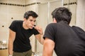 Headshot of attractive young man brushing teeth Royalty Free Stock Photo