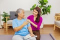 Headshot beautiful grateful daughter lovingly hugs elderly mother in home. Royalty Free Stock Photo