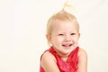 Headshot of blonde toddler girl