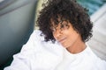 Headshot of carefree pensive afro american black young girl in outdoor. Beautiful african model thinking alone. Black hair curly.