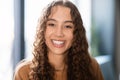 Headshot of cheerful brown haired teenager girl with captivating smile