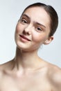 Headshot of emotional female face portrait with calm and tender facial expression