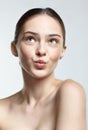 Headshot of emotional female face portrait with romantic flirty facial expression